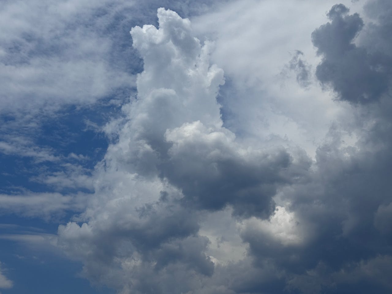 Spectacular cumulus clouds over Sardegna, Italy, showcasing a dynamic sky scene.